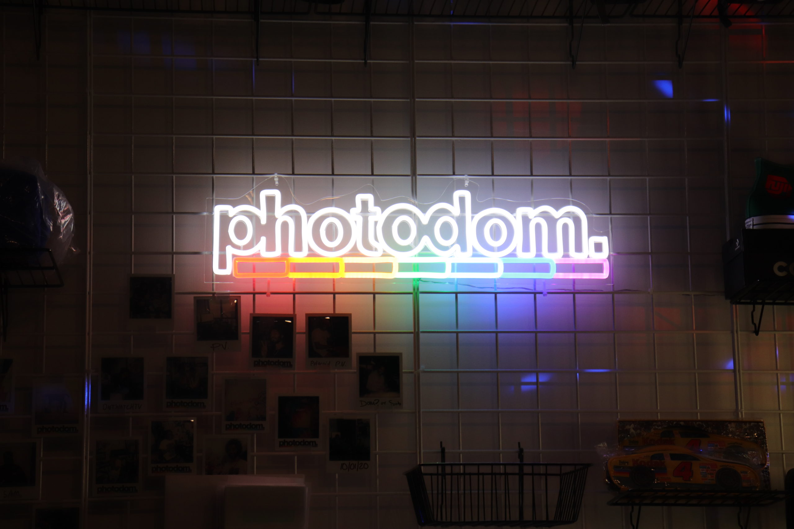 Photodom's neon sign glows in the dark.