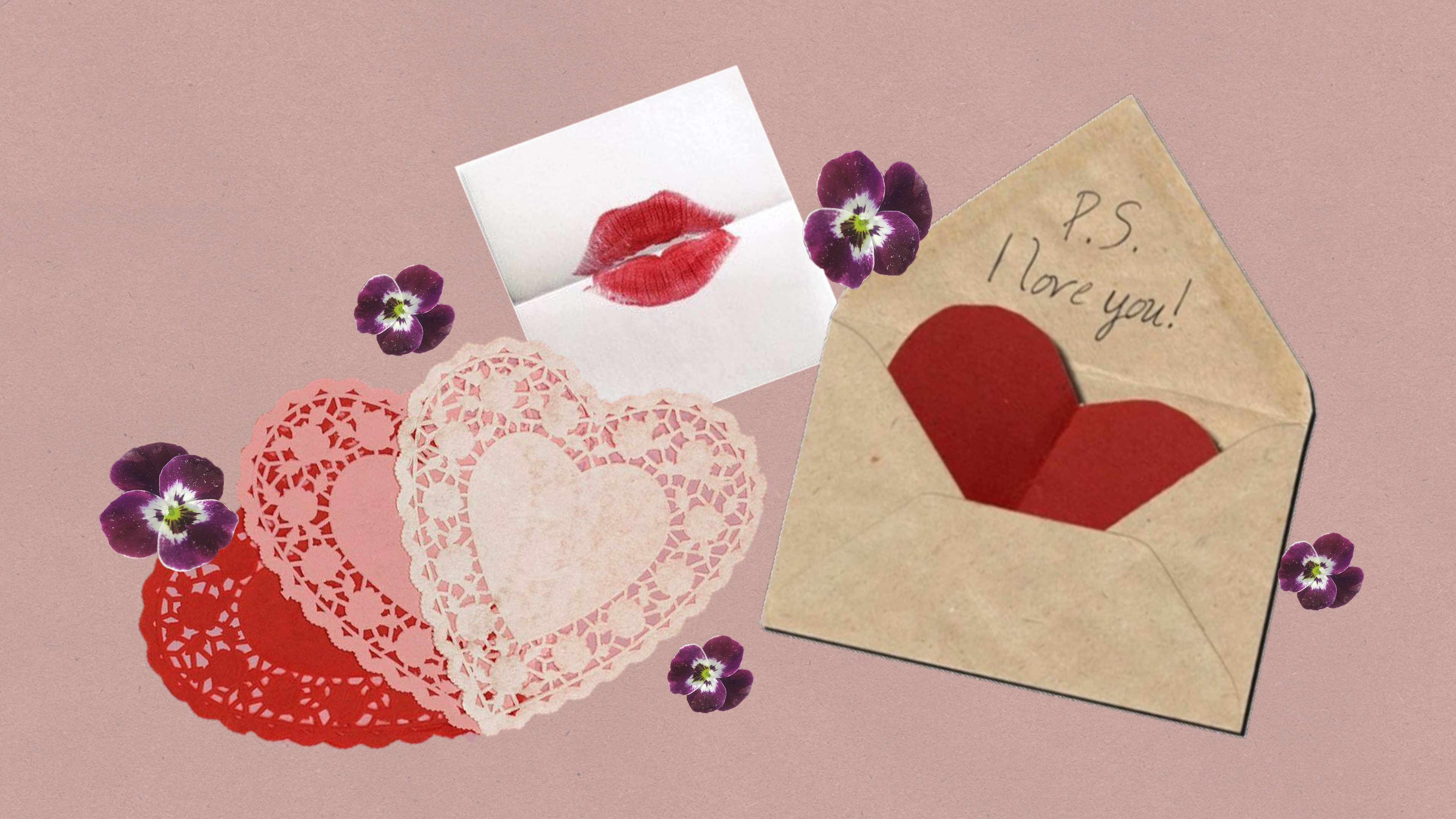 Love letters and hearts laid against a mauve background.