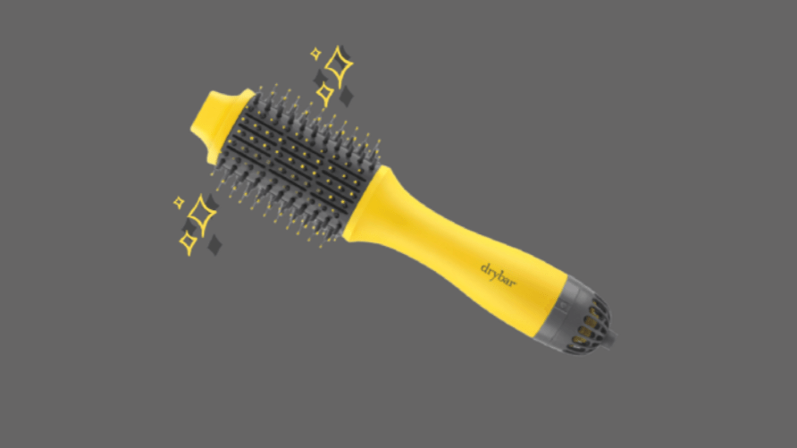 Photo of the Drybar Double Shot hair tool against a gray background by Maggie Chirdo.
