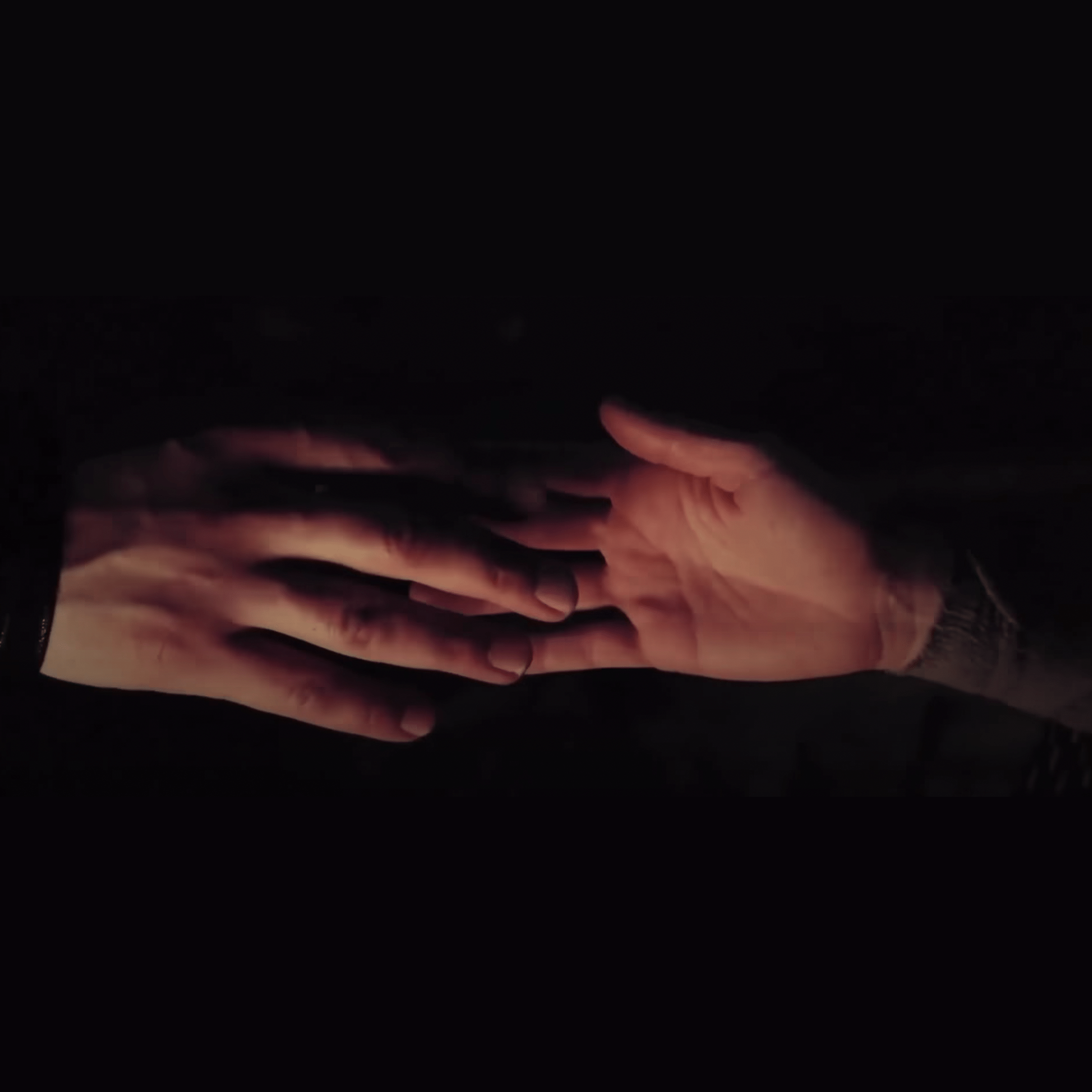 Rey and Kylo Ren's hands touch in the infamous scene from "The Last Jedi."